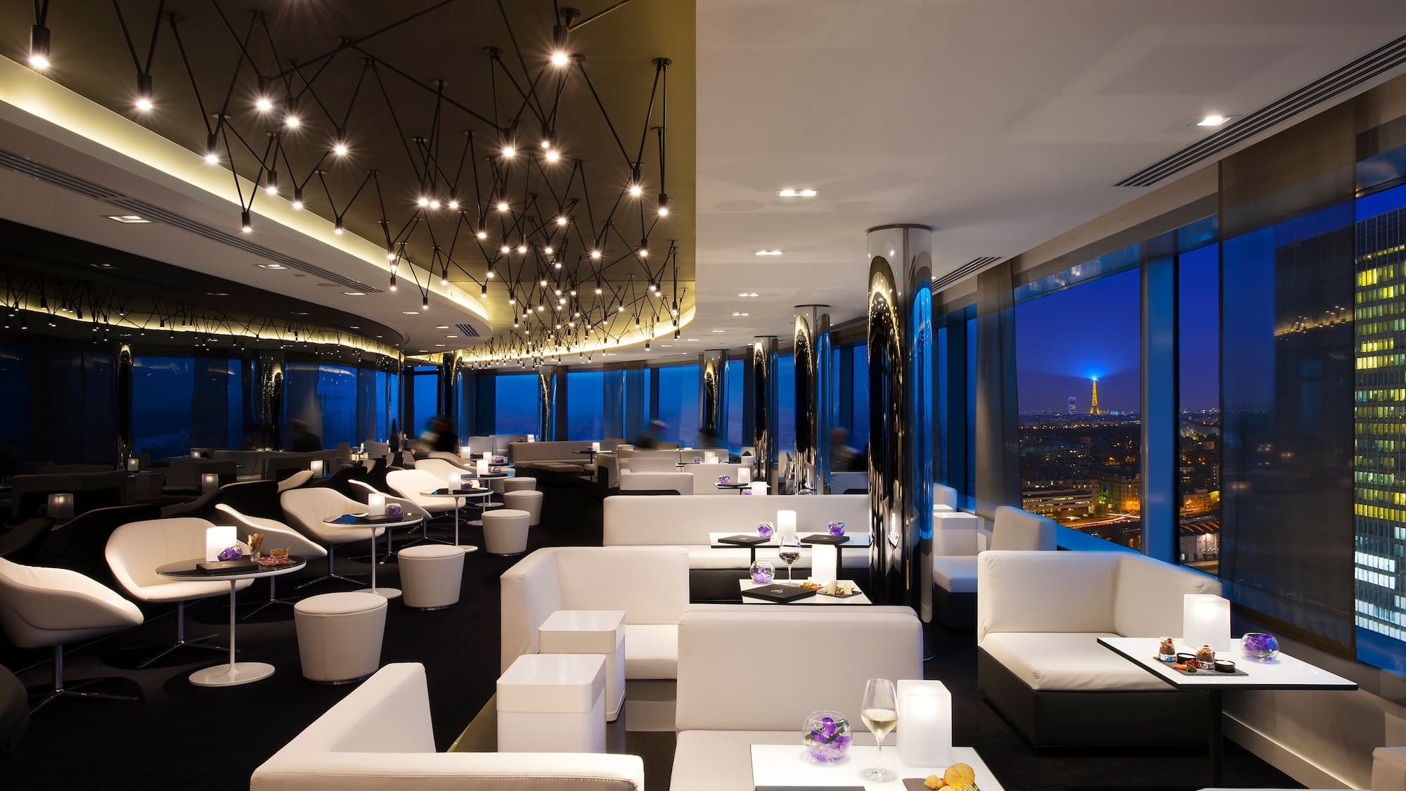 a room with white furniture and lights