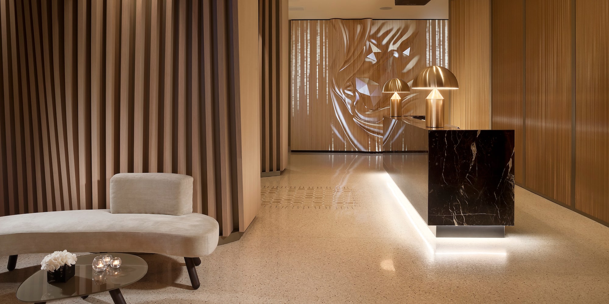 a lobby with a marble counter and a table
