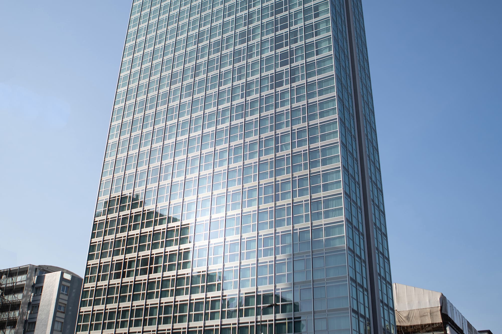 a tall glass building with many windows