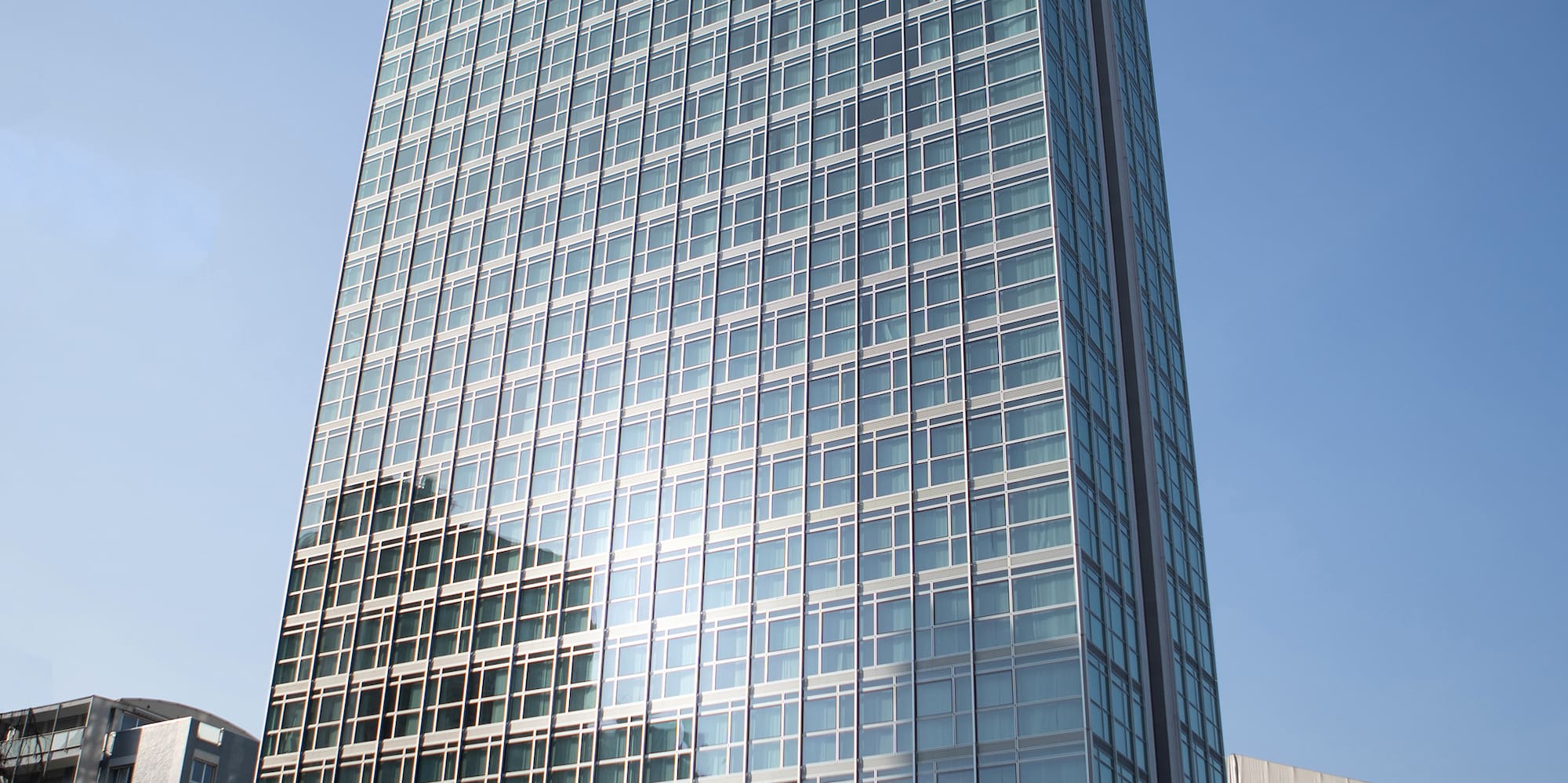 a tall glass building with many windows