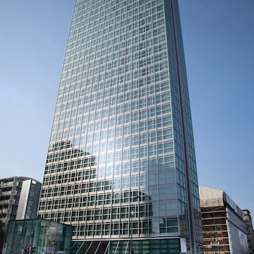 a tall glass building with many windows
