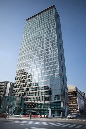 a tall glass building with many windows