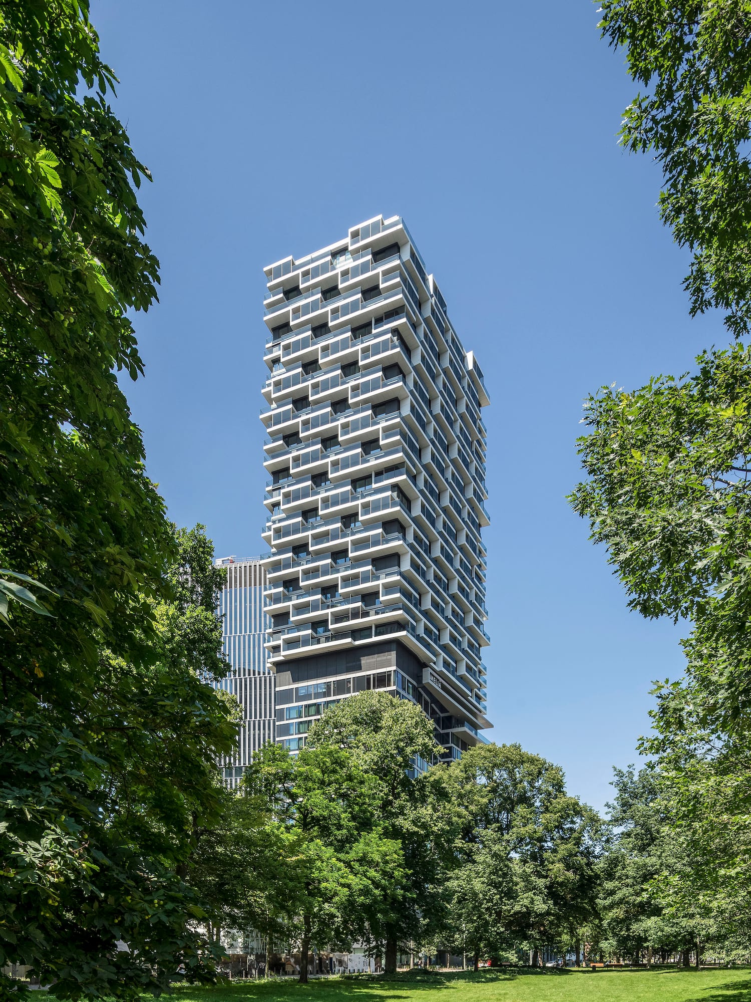 a tall building with trees around it