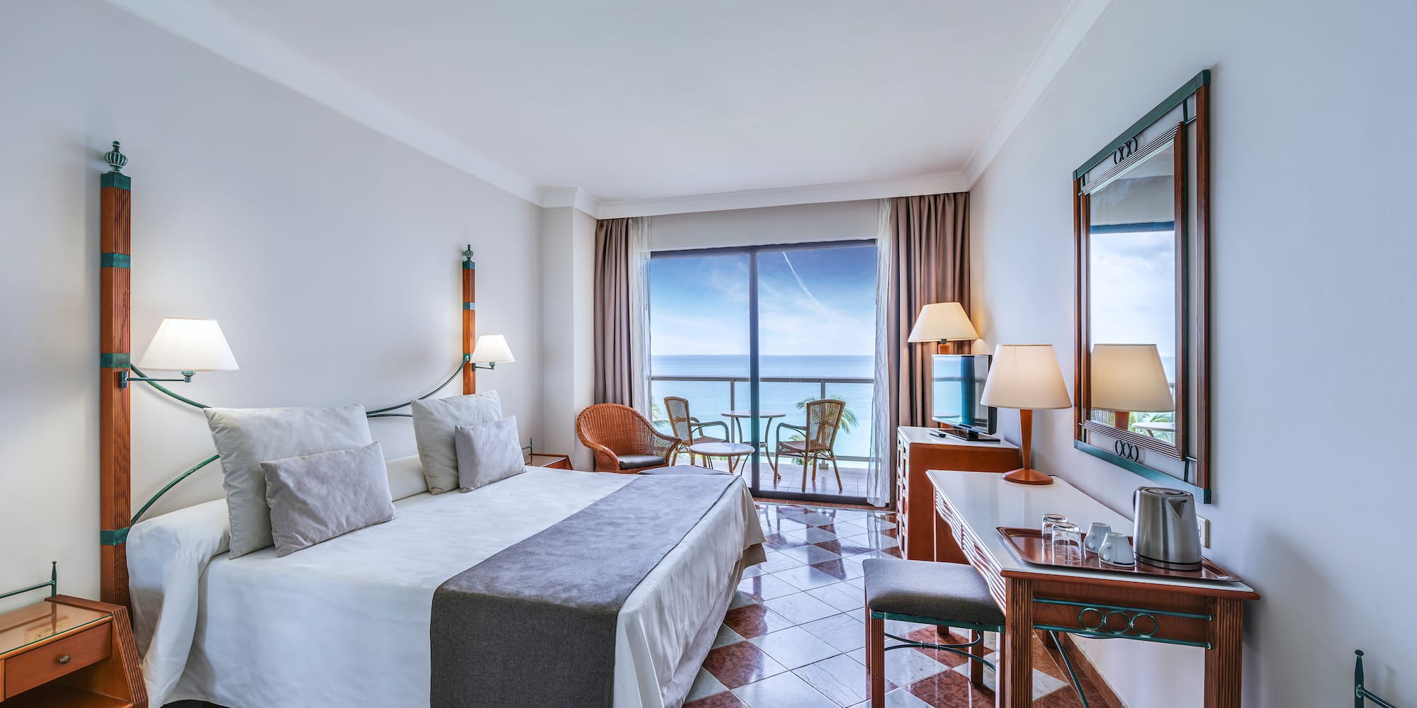 a room with a large window and a bed