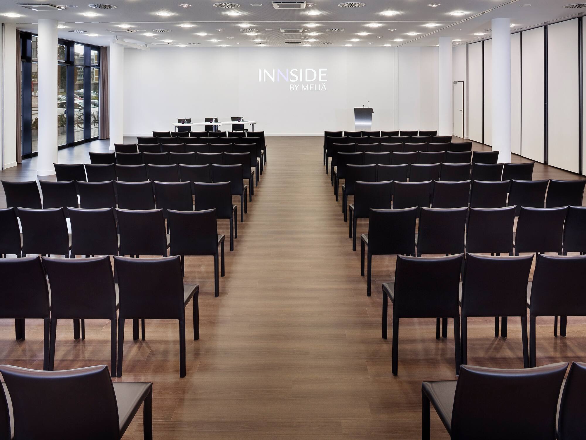 a room with rows of chairs