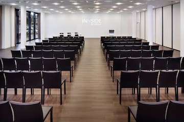 a room with rows of chairs
