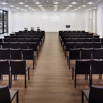 a room with rows of chairs