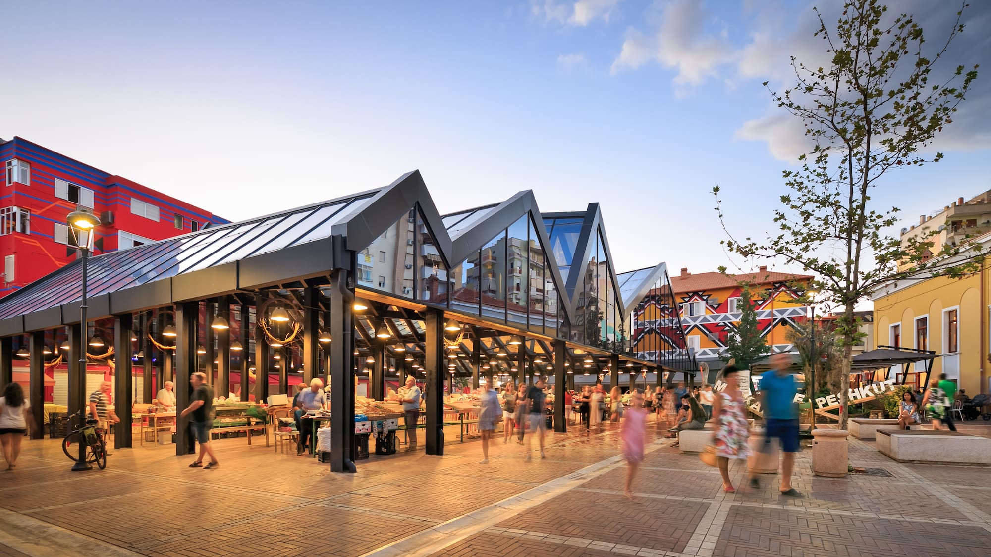 people walking around a market