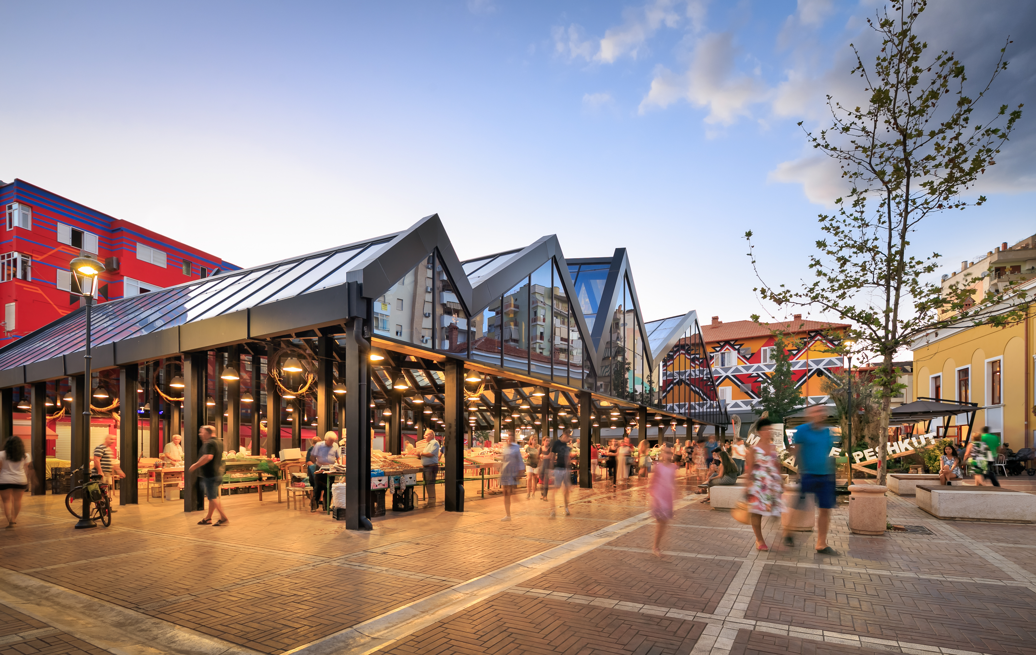 people walking around a market