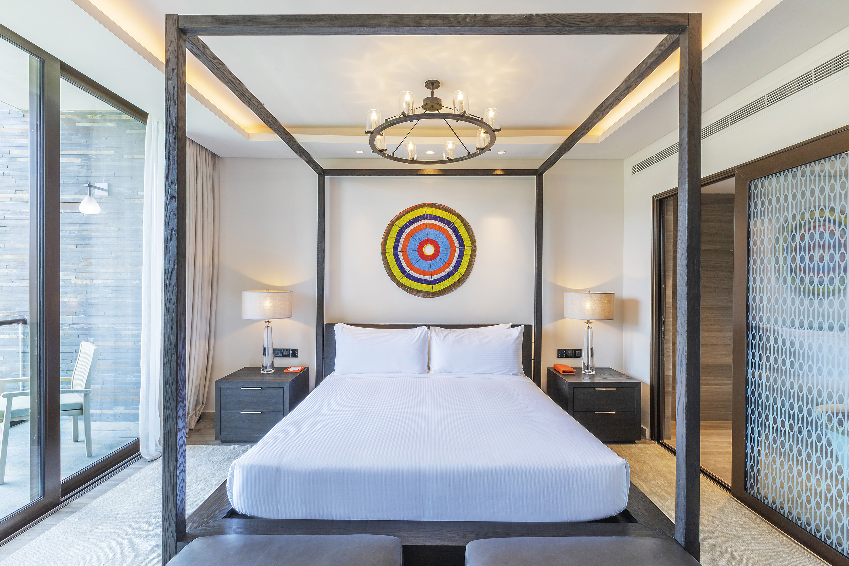 a bed with a four poster bed