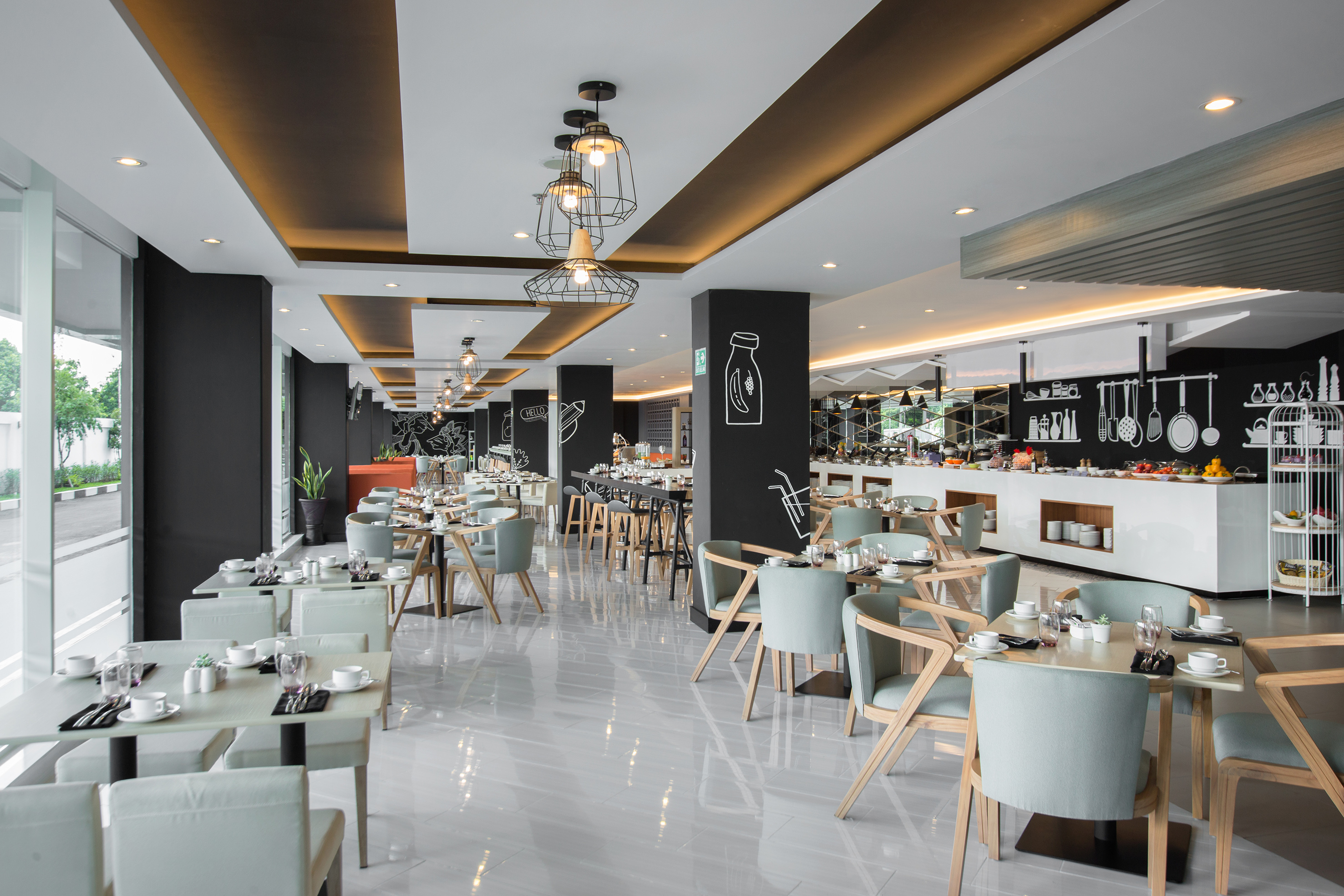 Modern restaurant dining area with a full buffet and contemporary seating.