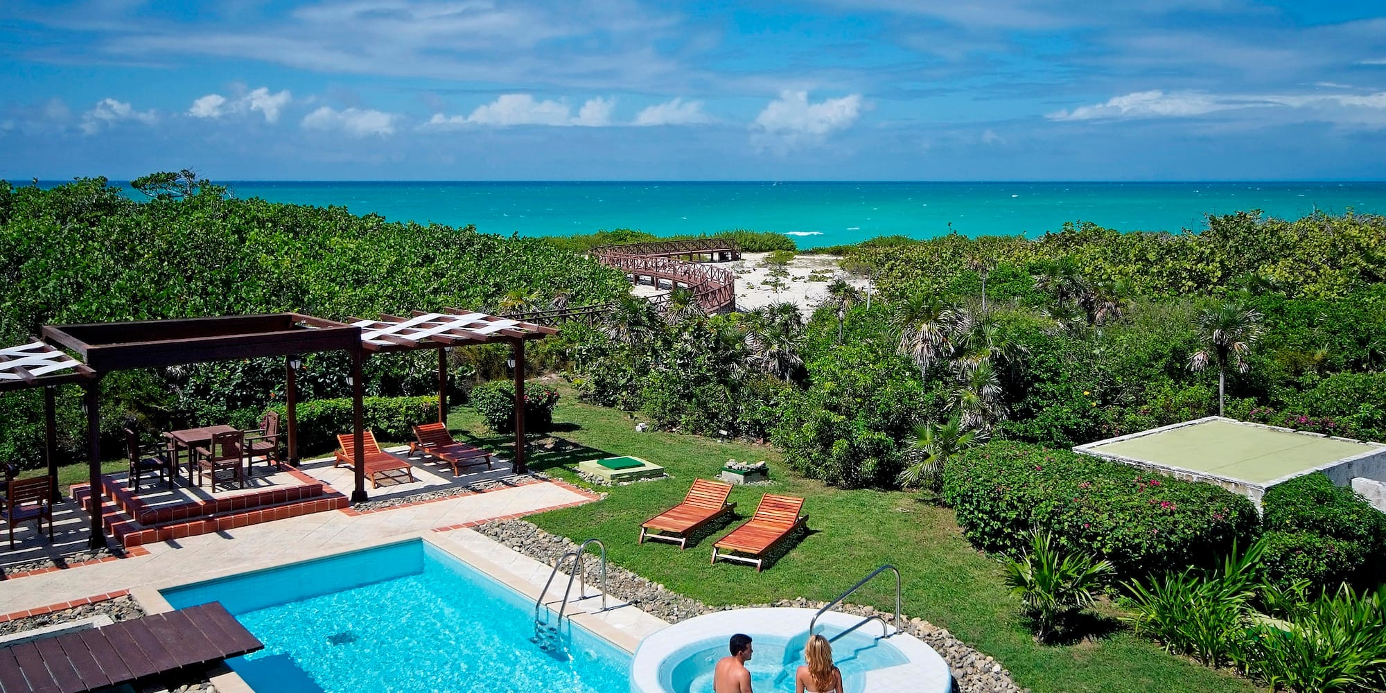a couple of people sitting in a pool