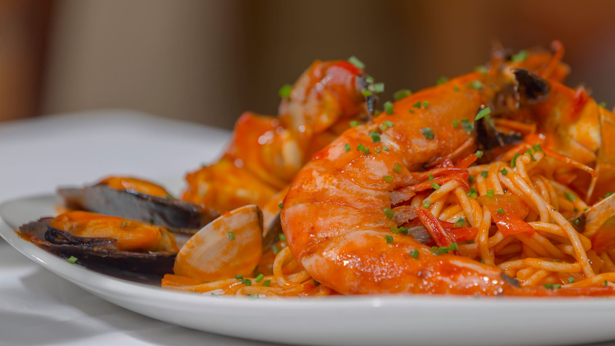 a plate of seafood spaghetti and shrimp