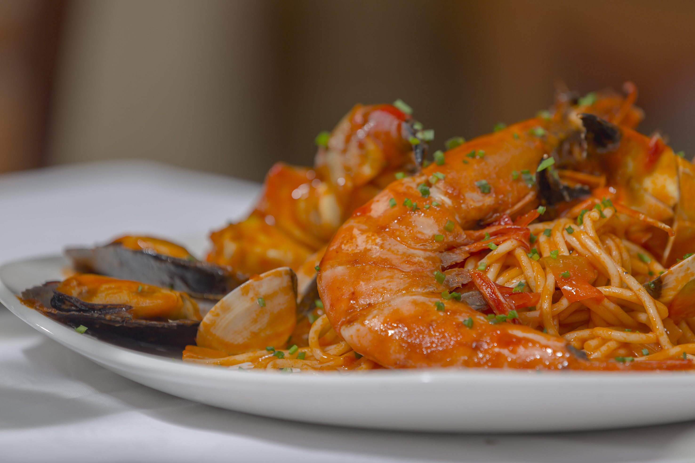 a plate of seafood spaghetti and shrimp