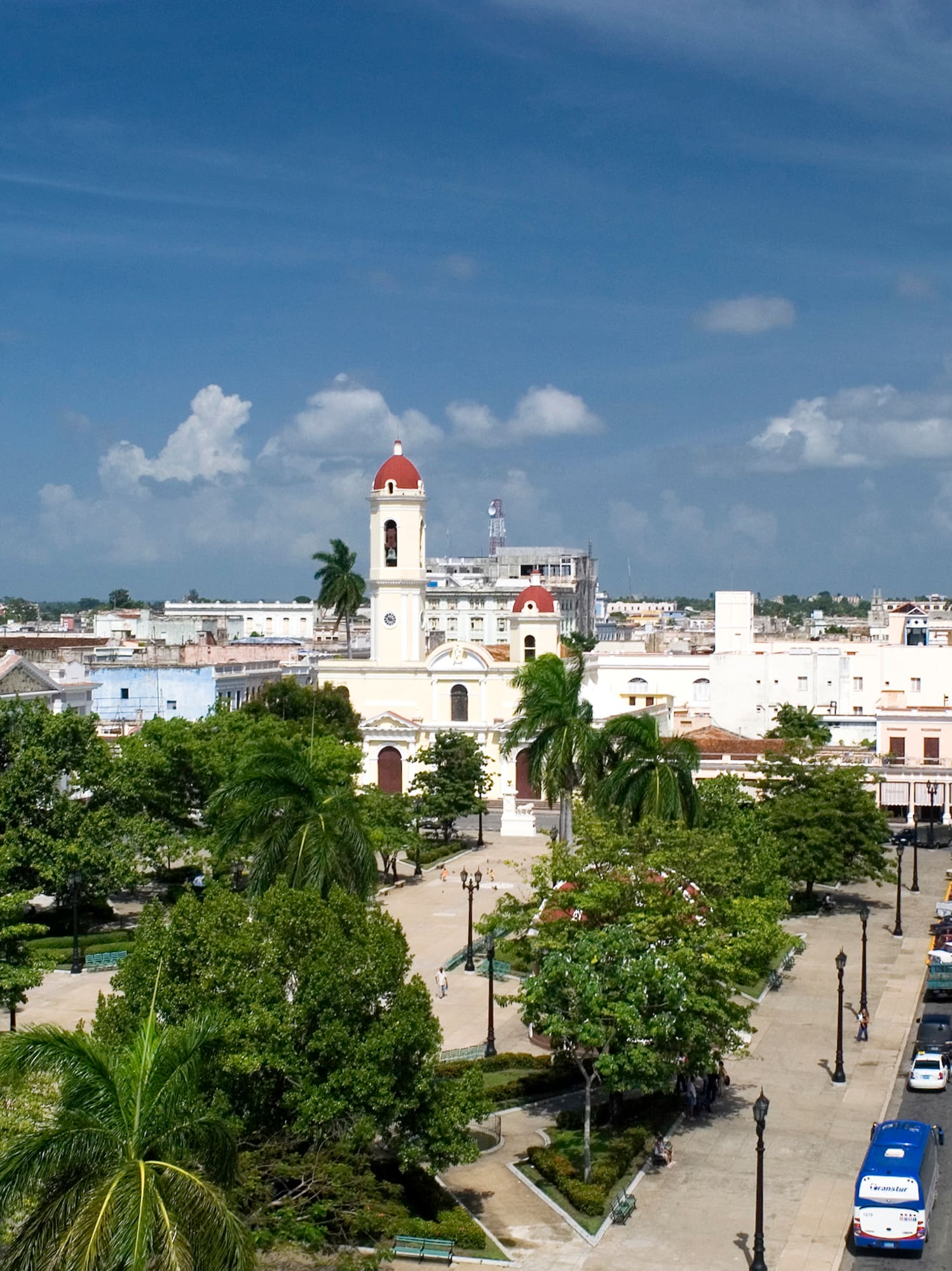 a city with a tall tower and trees