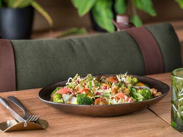 a bowl of salad on a table
