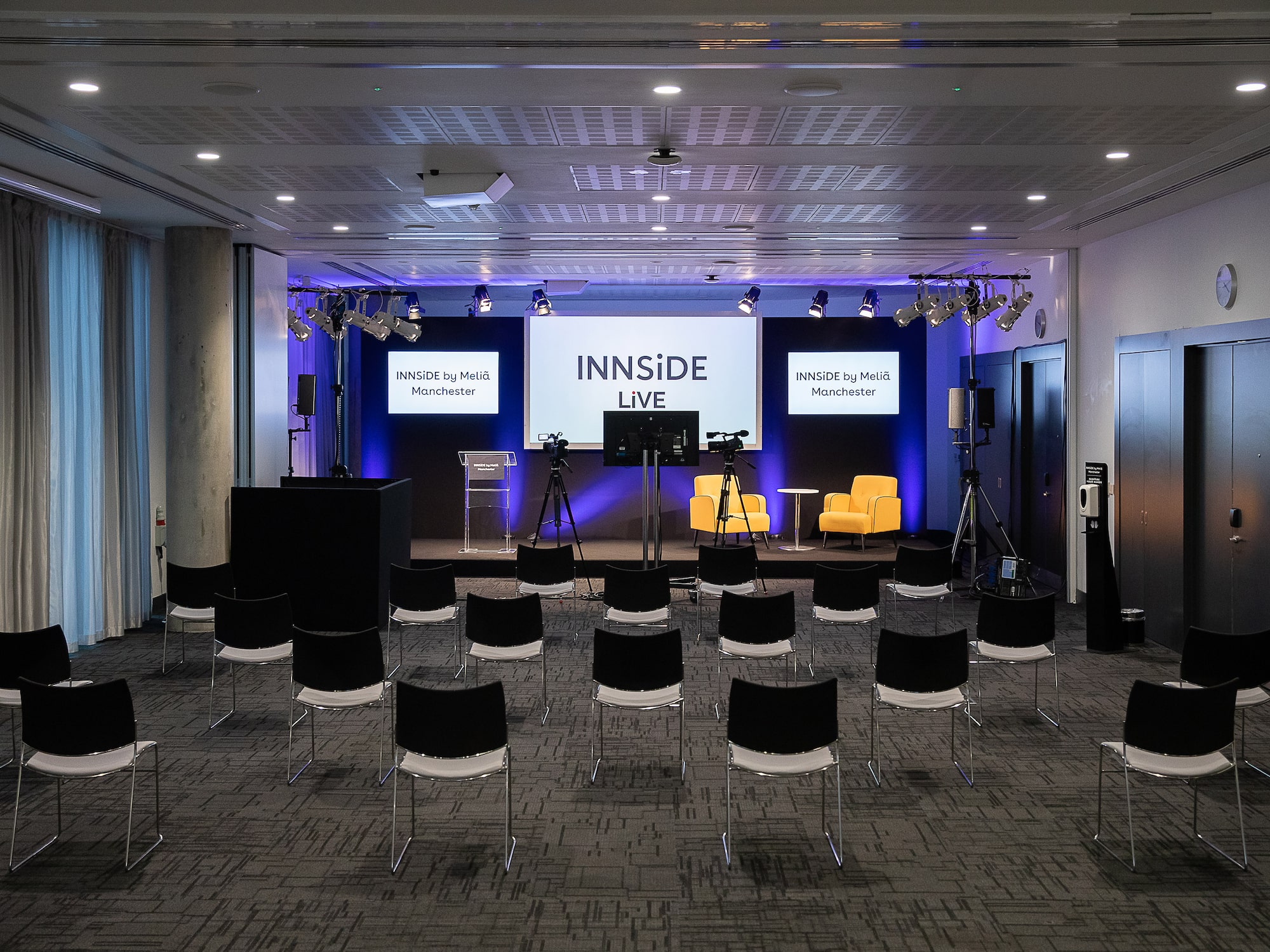 a room with chairs and a stage