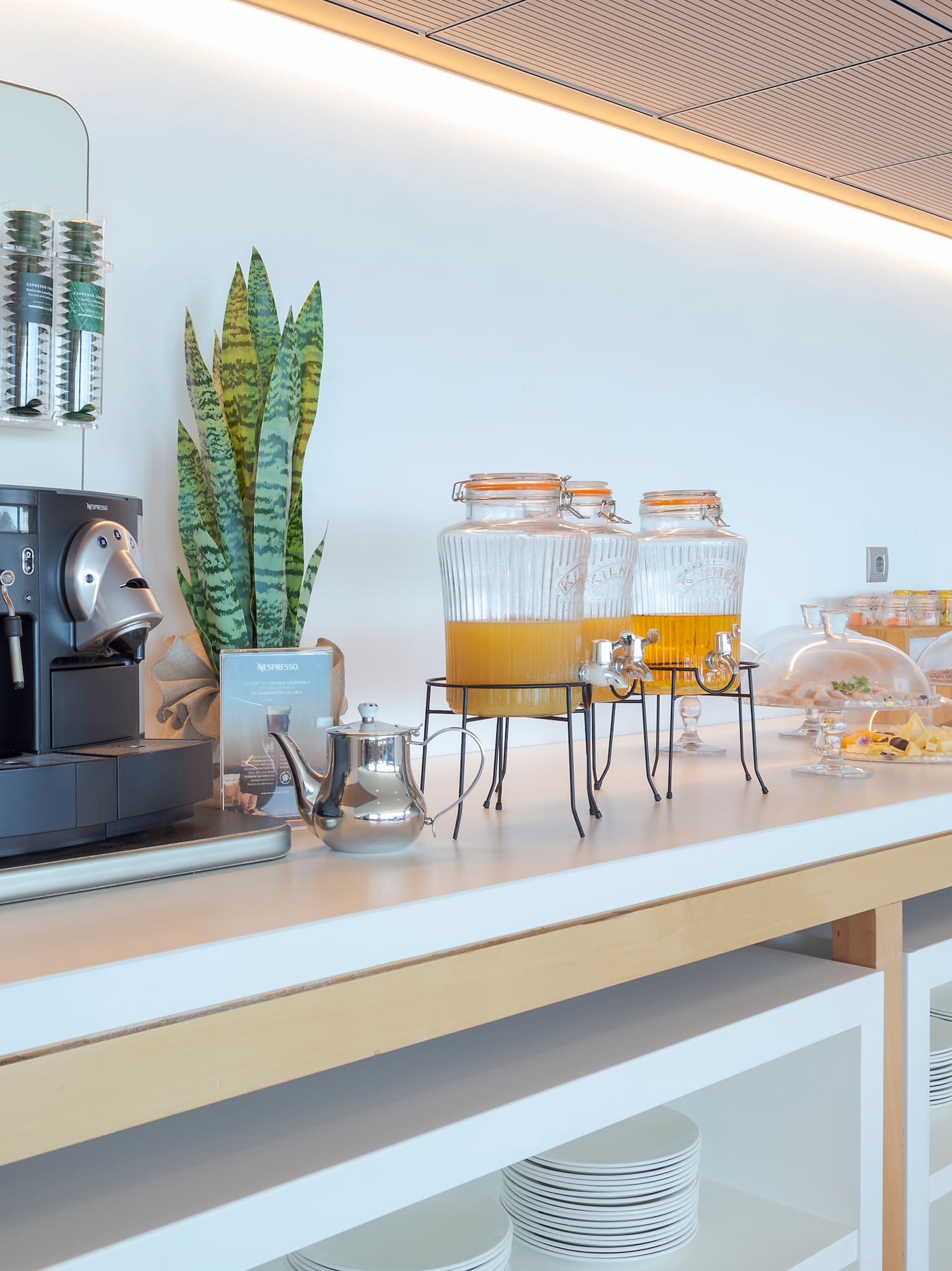 a coffee machine and drinks on a counter