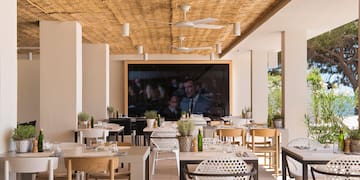 a restaurant with tables and chairs