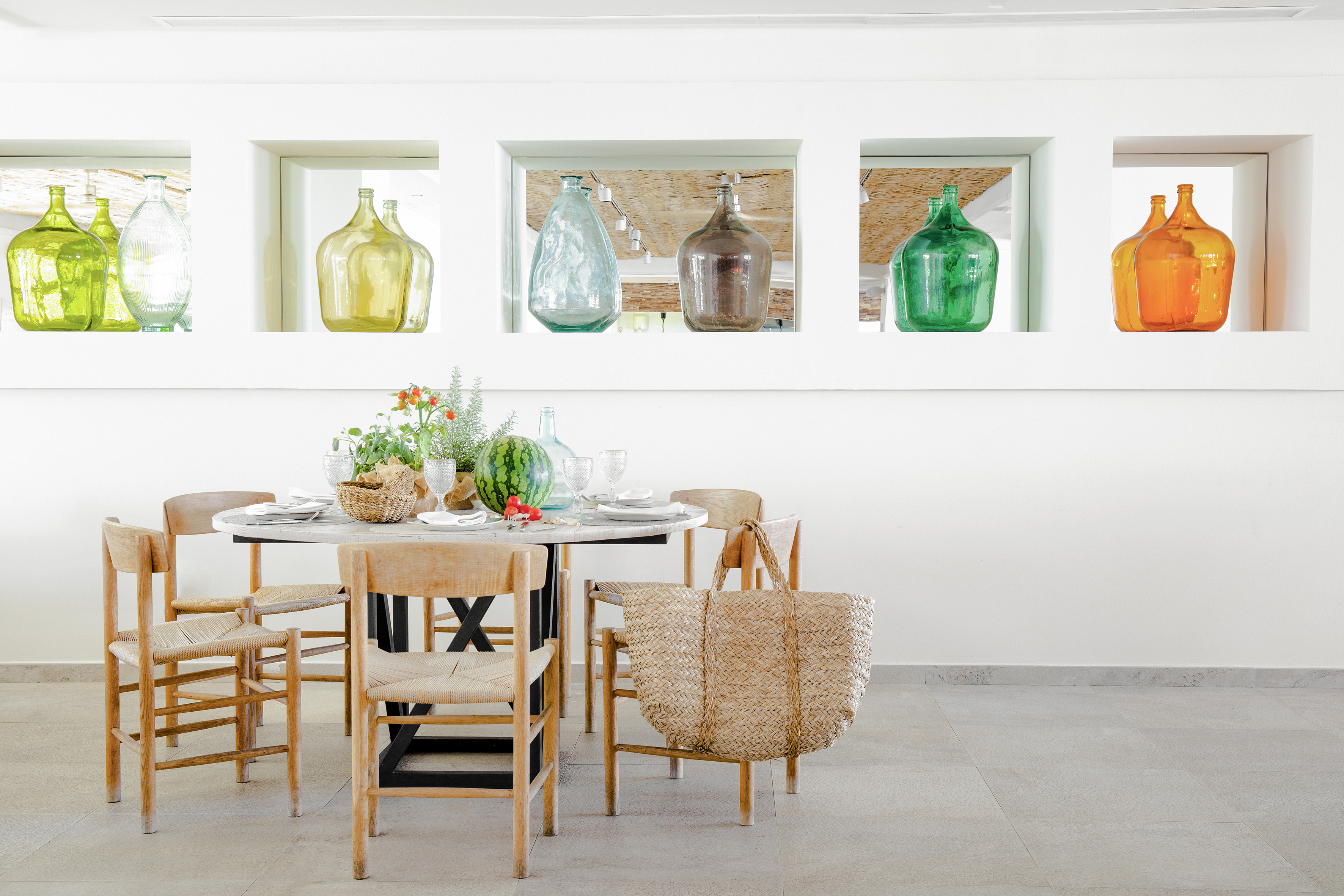 a table with chairs and baskets on it