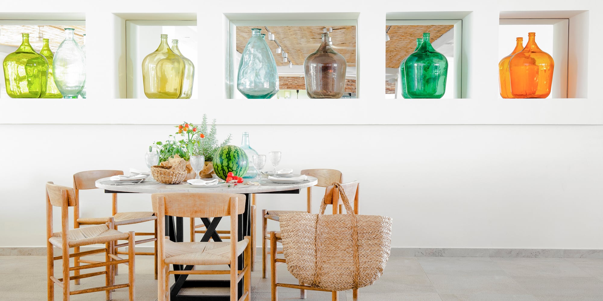 a table with chairs and baskets on it