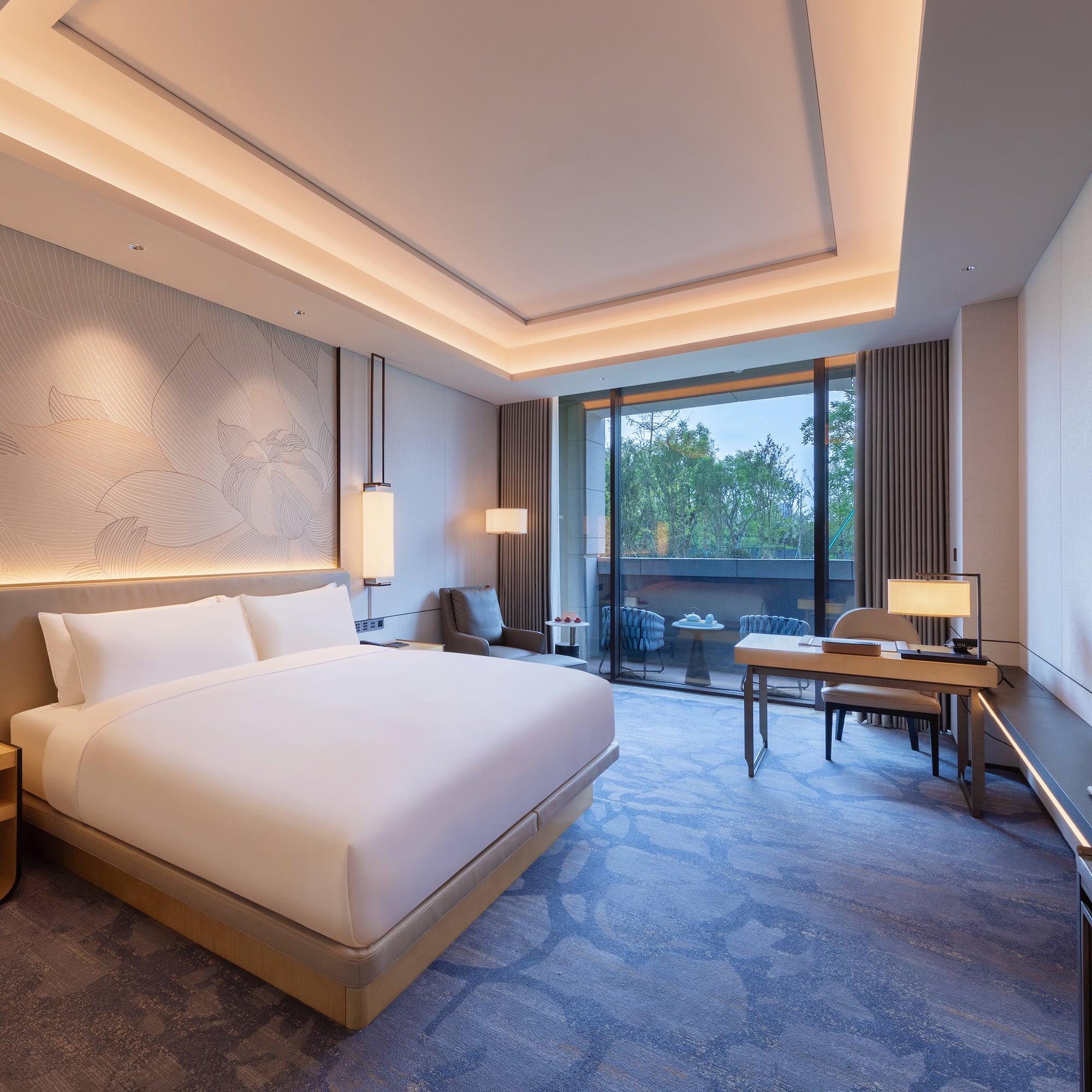 a room with a bed and a desk