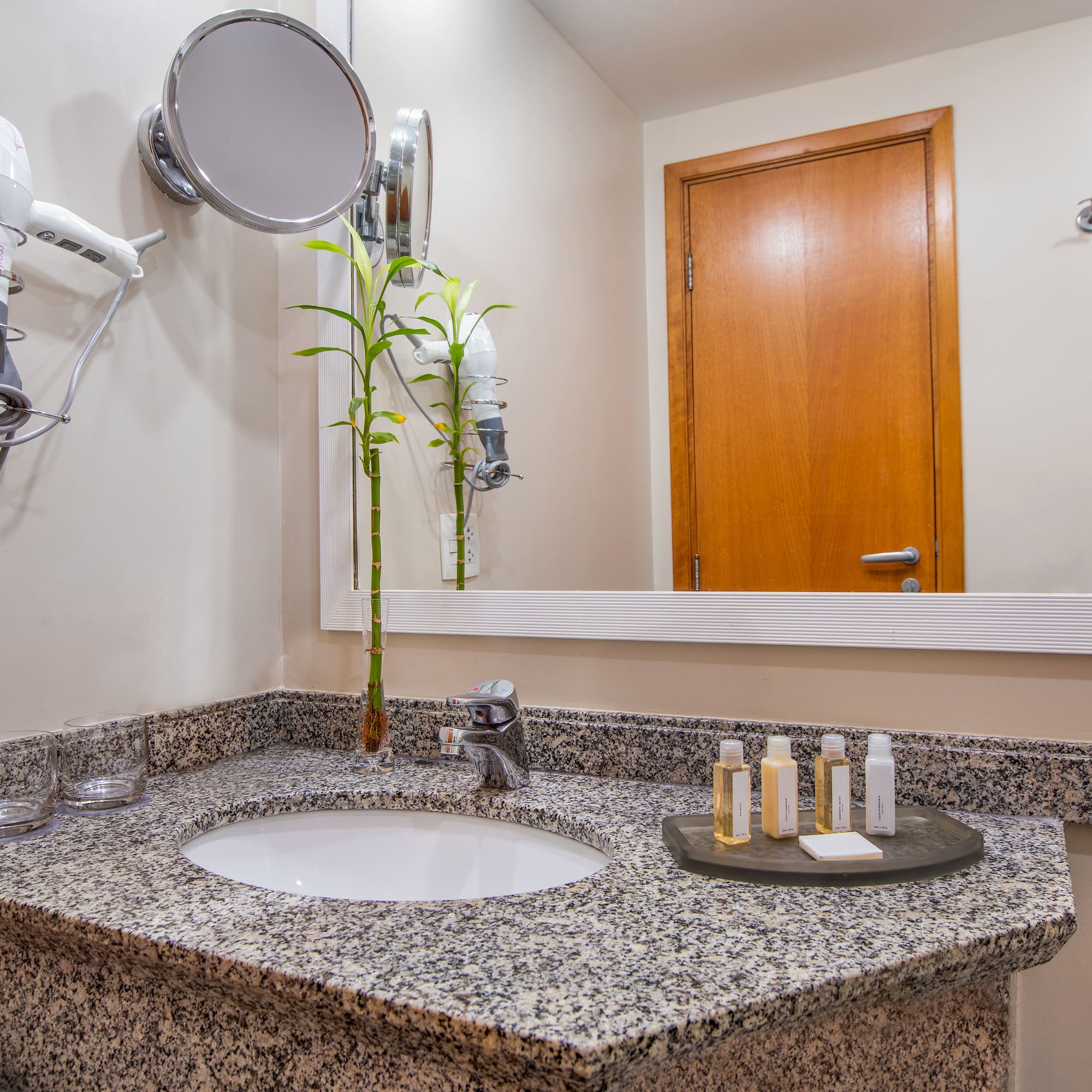 a bathroom with a mirror and a sink