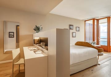 a room with a bed and a desk