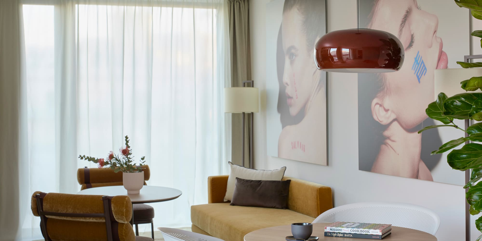 a living room with a couch and pictures on the wall