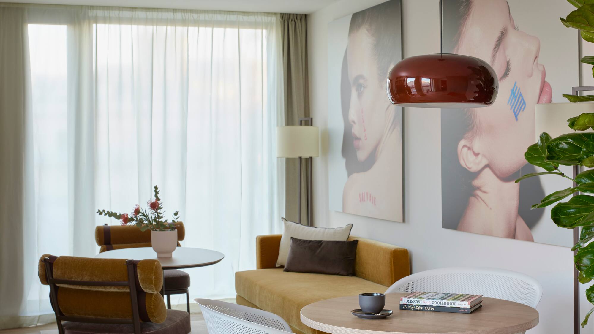 a living room with a couch and pictures on the wall