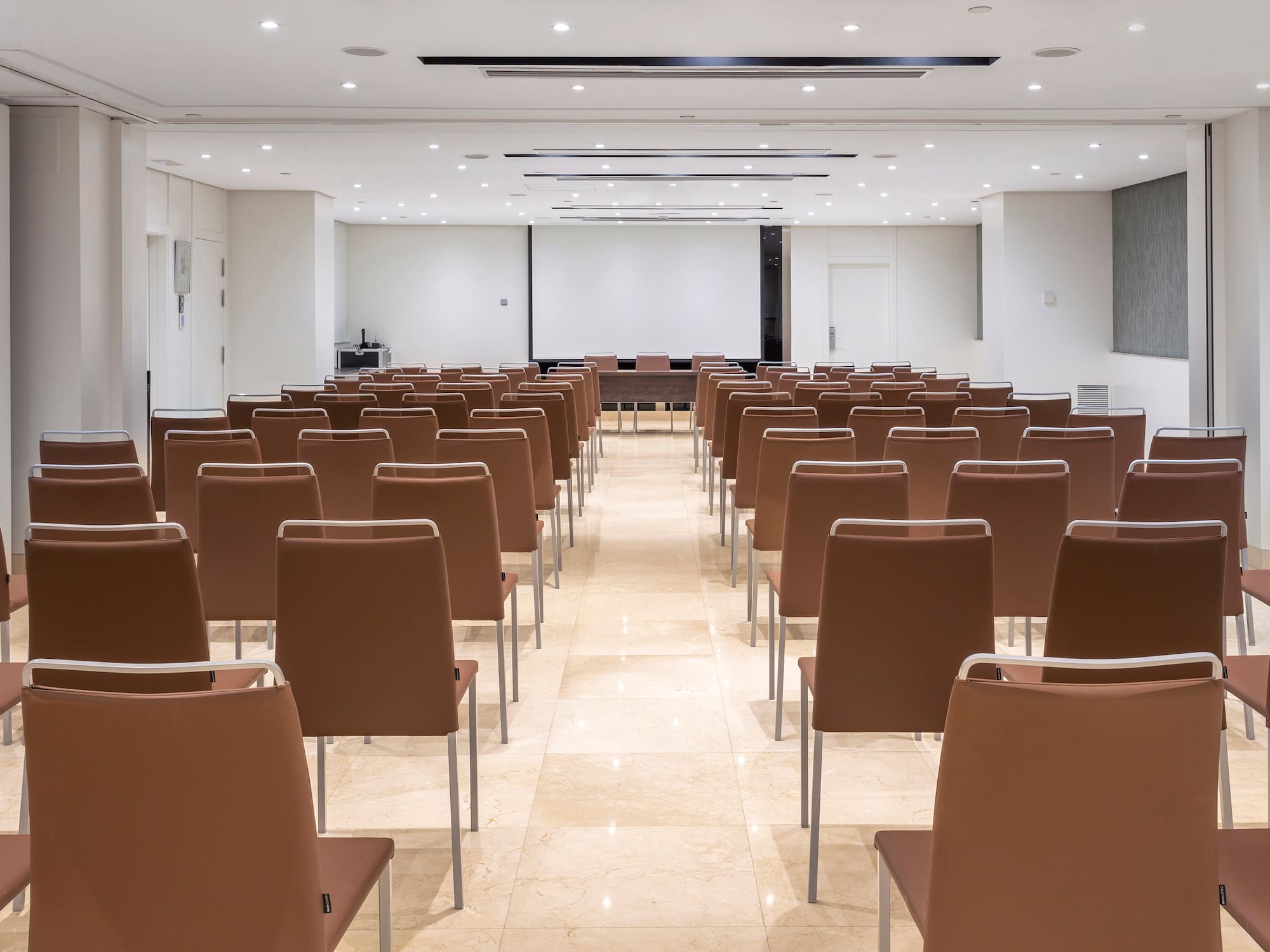 a room with rows of chairs