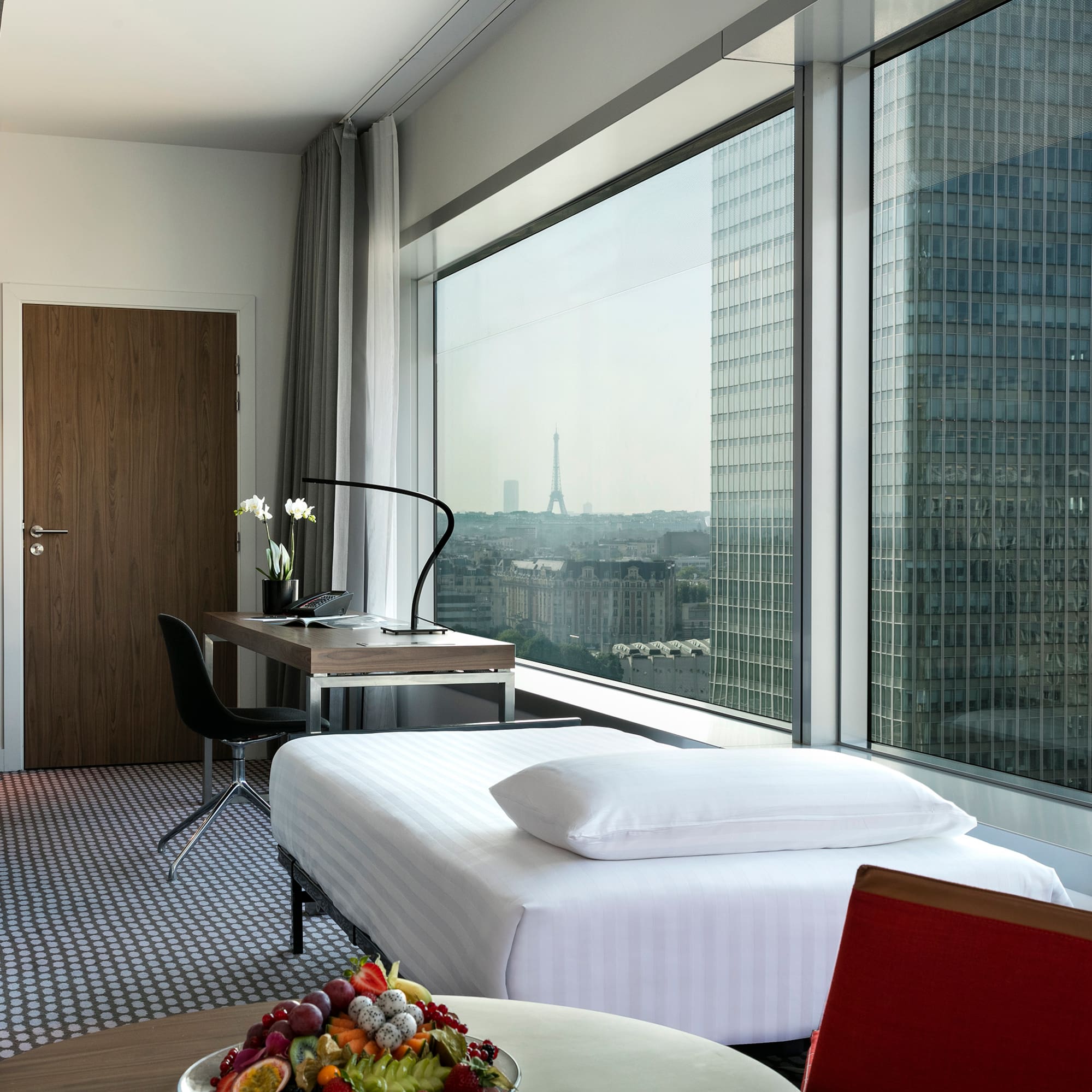 a room with a window and a table and chairs