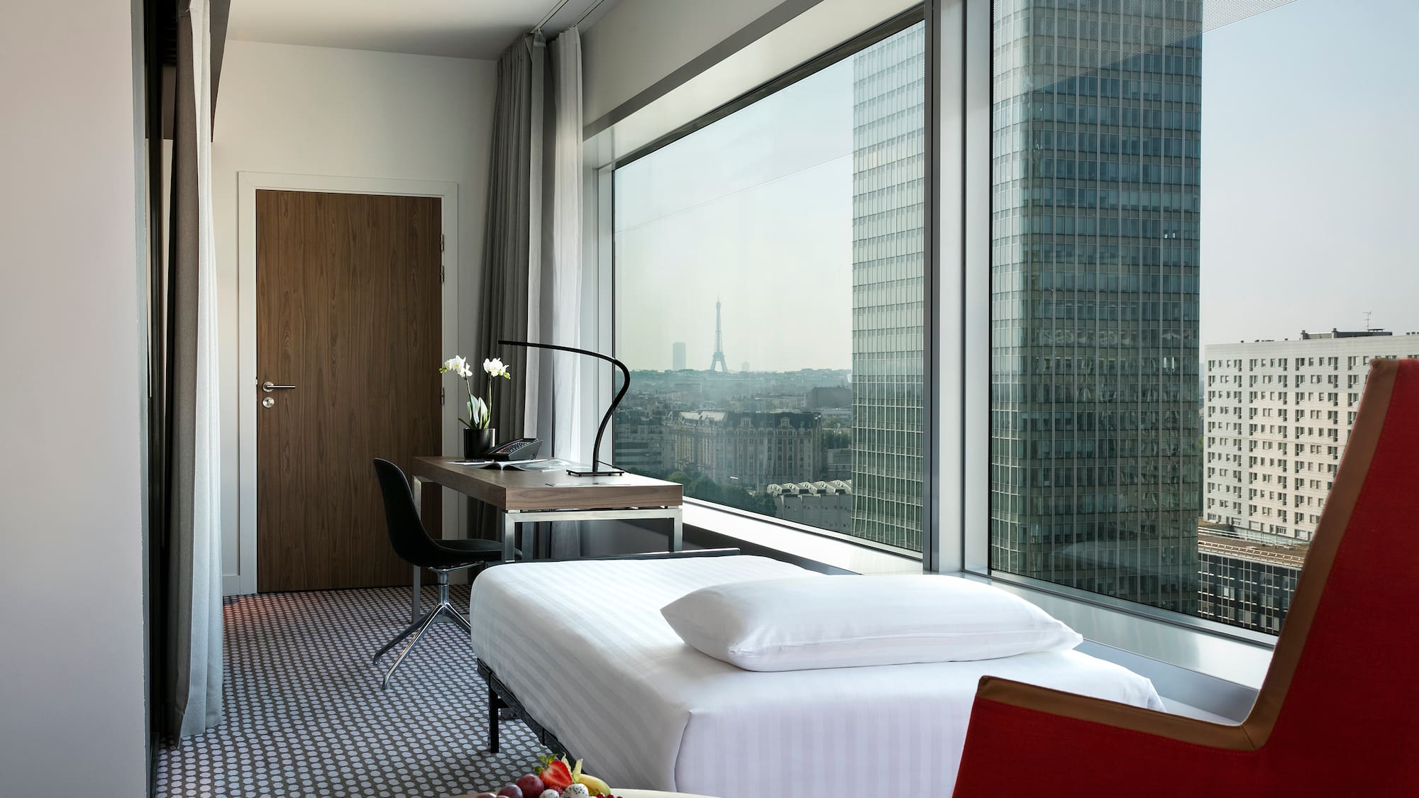 a room with a window and a table and chairs