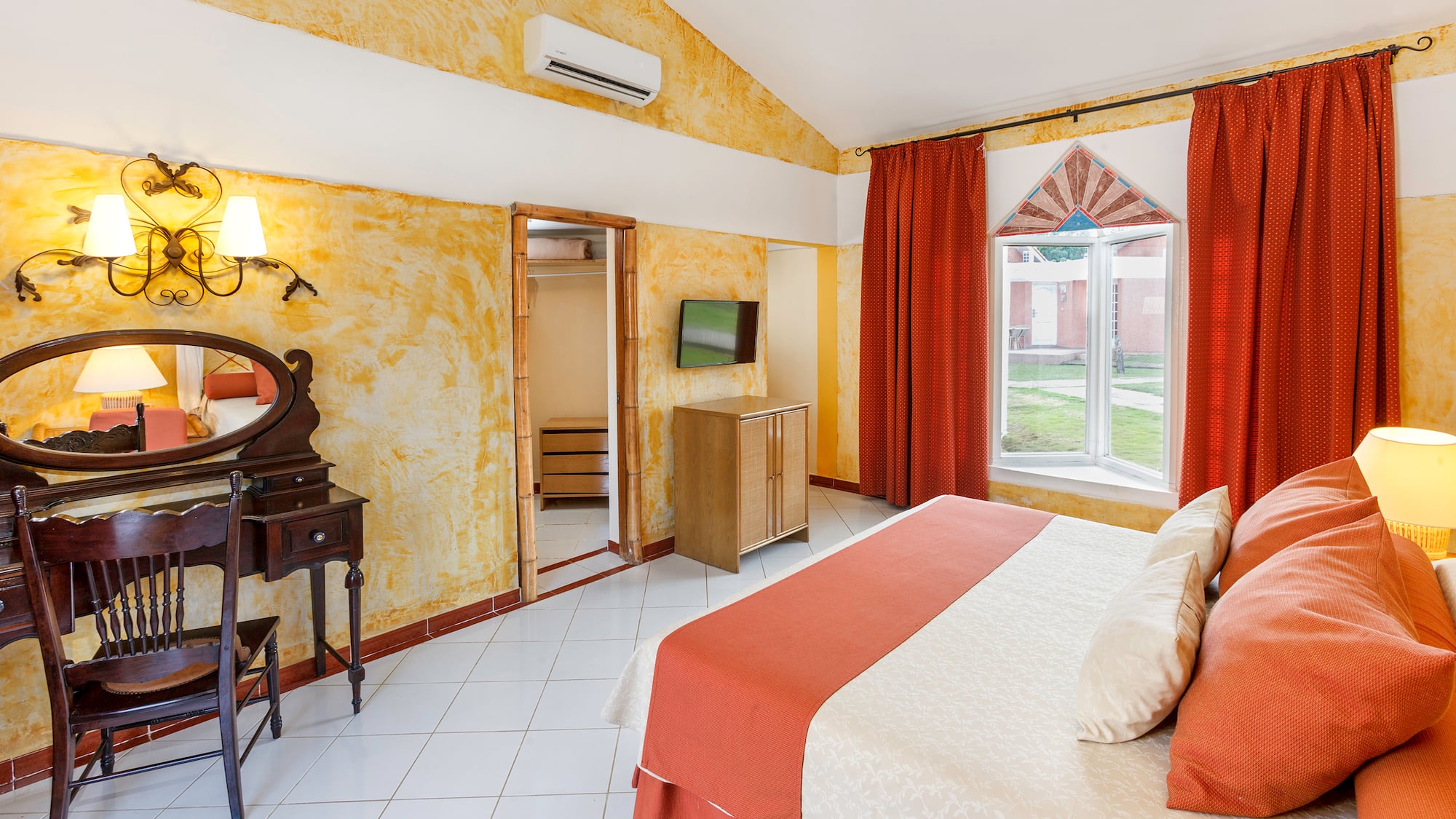 a room with a bed and a mirror