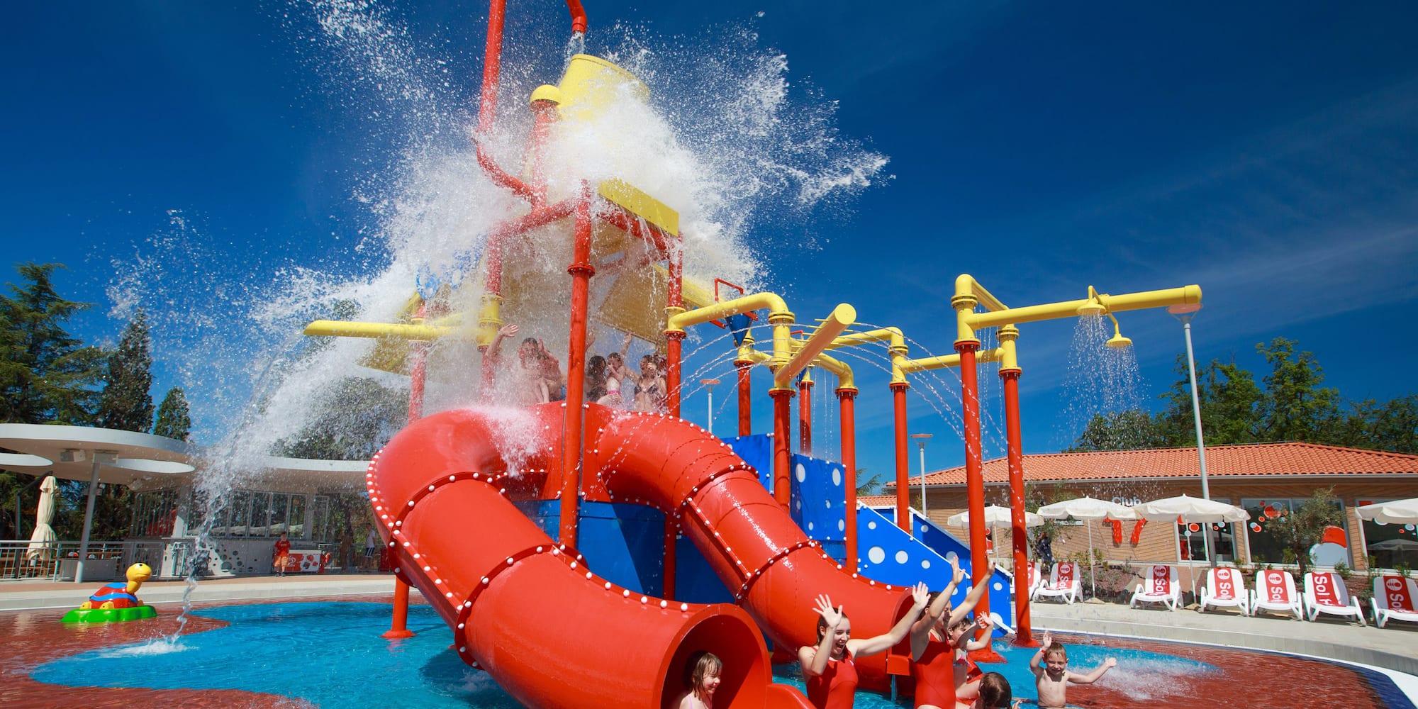 a group of kids in a water park