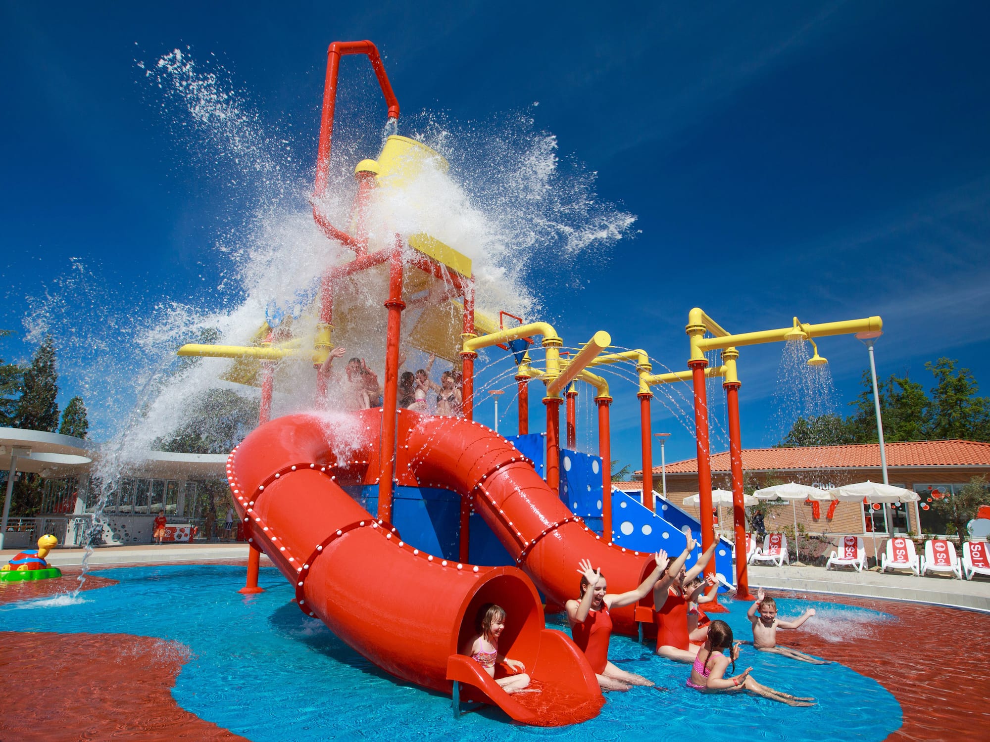 a group of kids in a water park