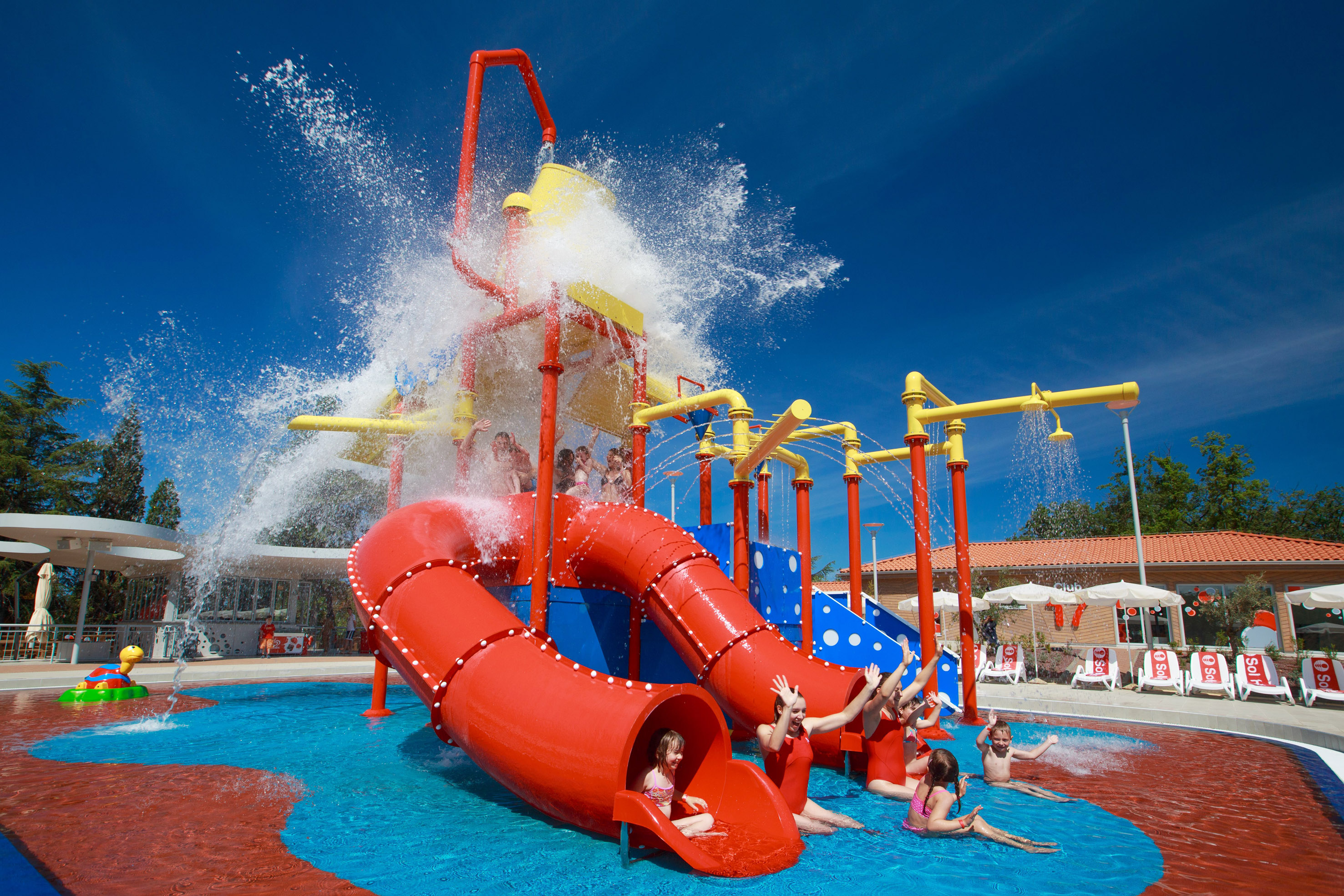 a group of kids in a water park