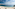 a beach with umbrellas and umbrellas