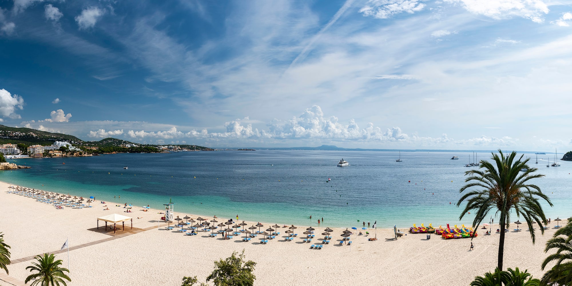 a beach with umbrellas and umbrellas