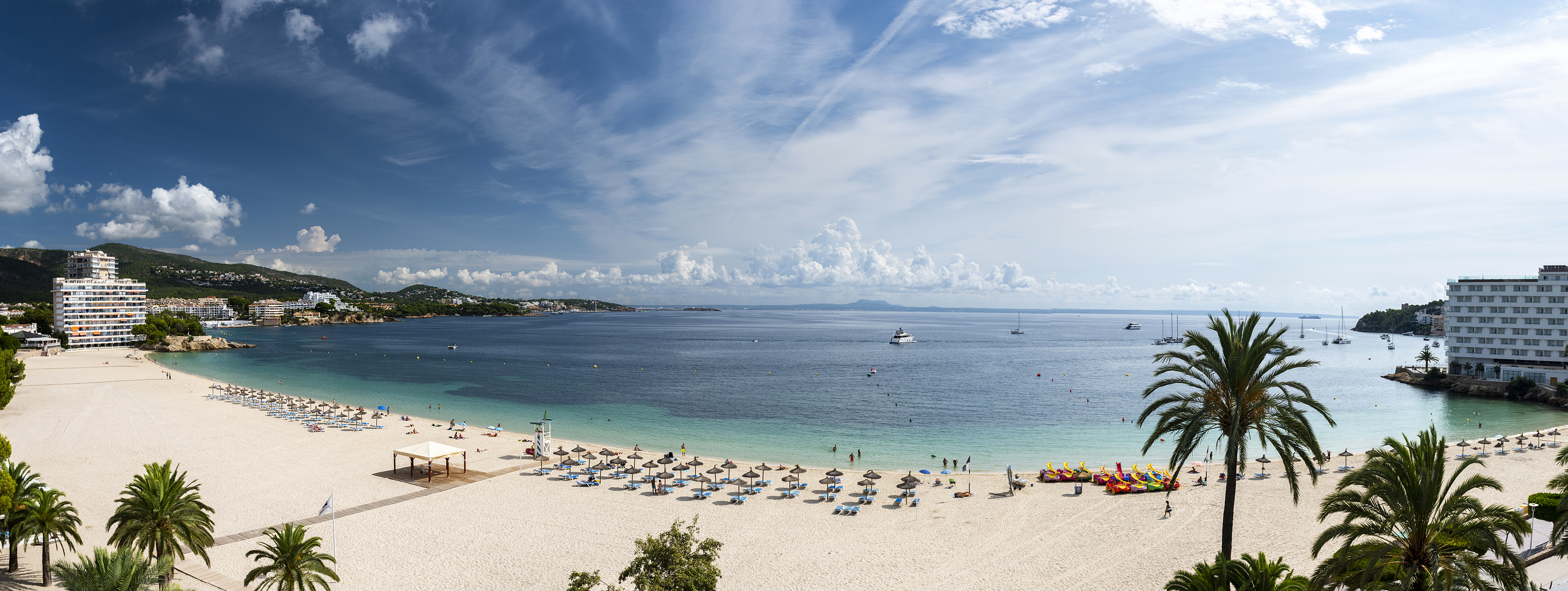 a beach with umbrellas and umbrellas