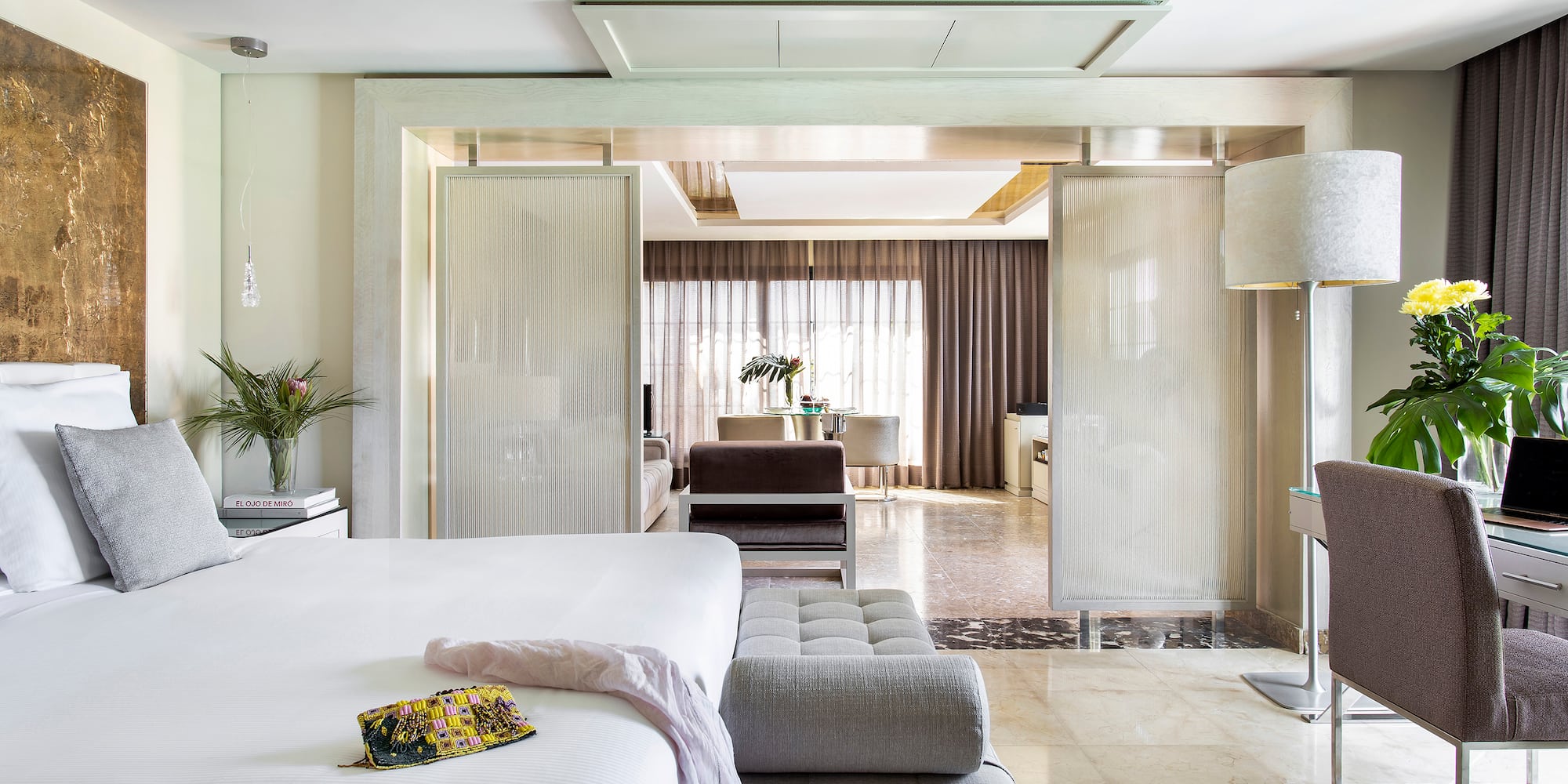 a bedroom with a bed and a couch