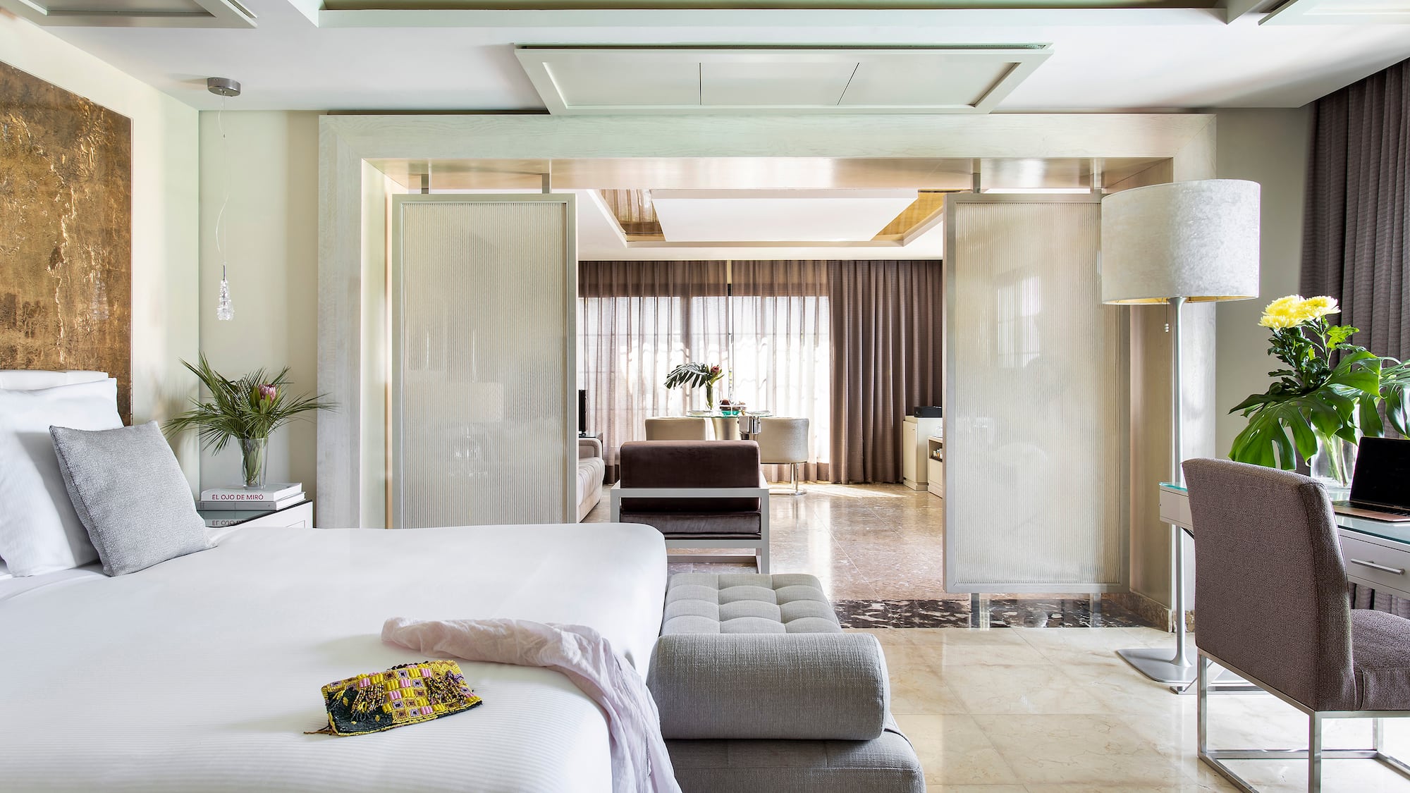 a bedroom with a bed and a couch