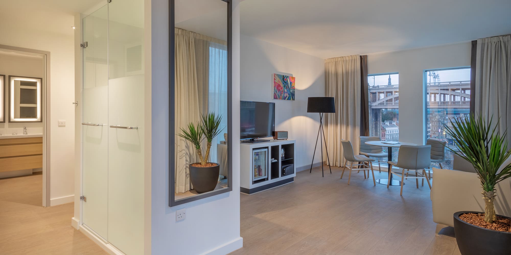 a room with a tv and a table