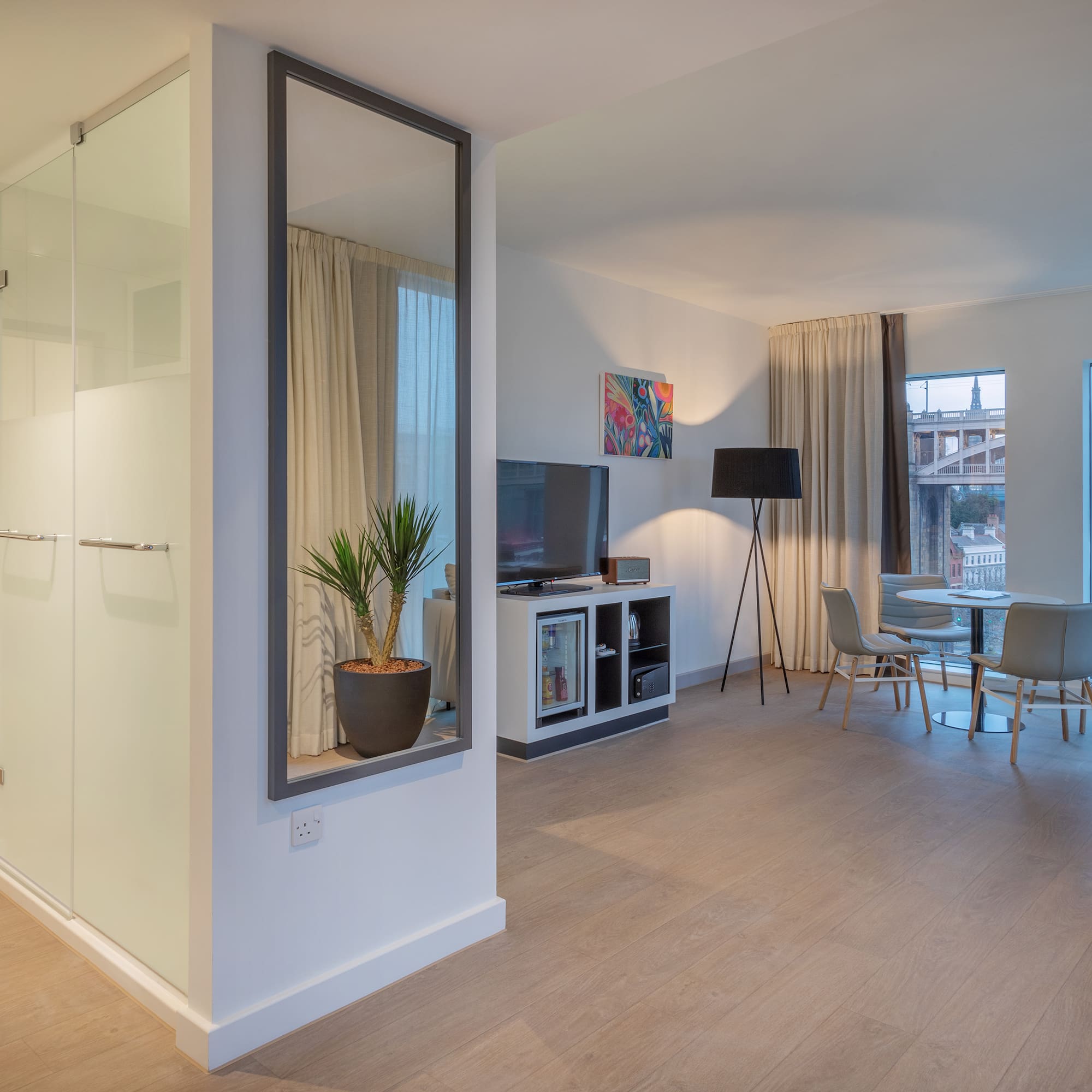 a room with a tv and a table