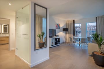 a room with a tv and a table