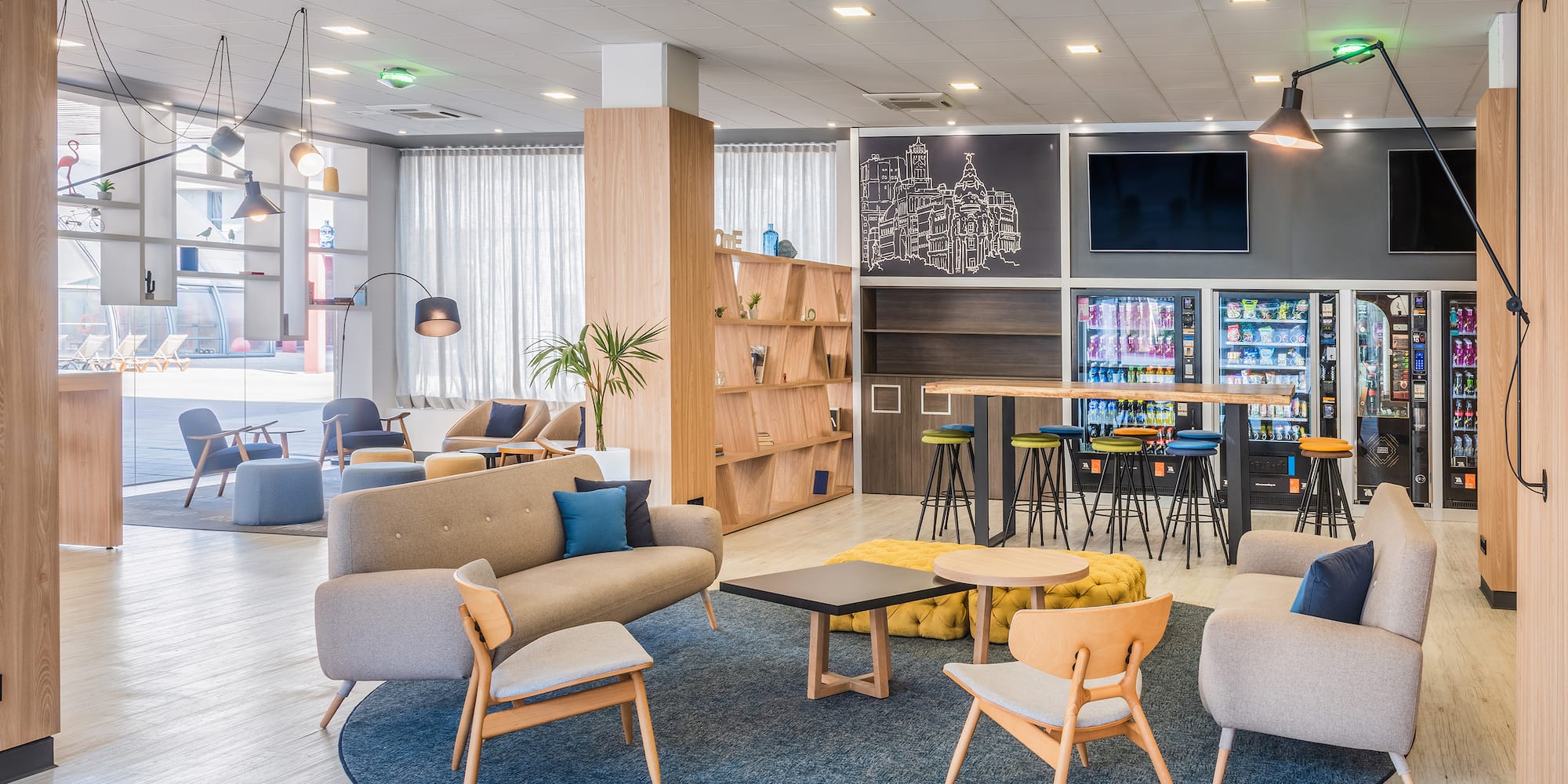 a room with a couch and chairs