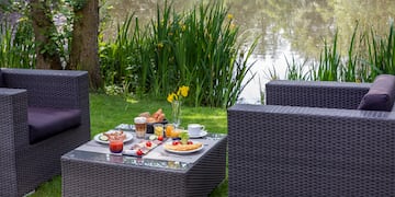 a table with food on it by a lake