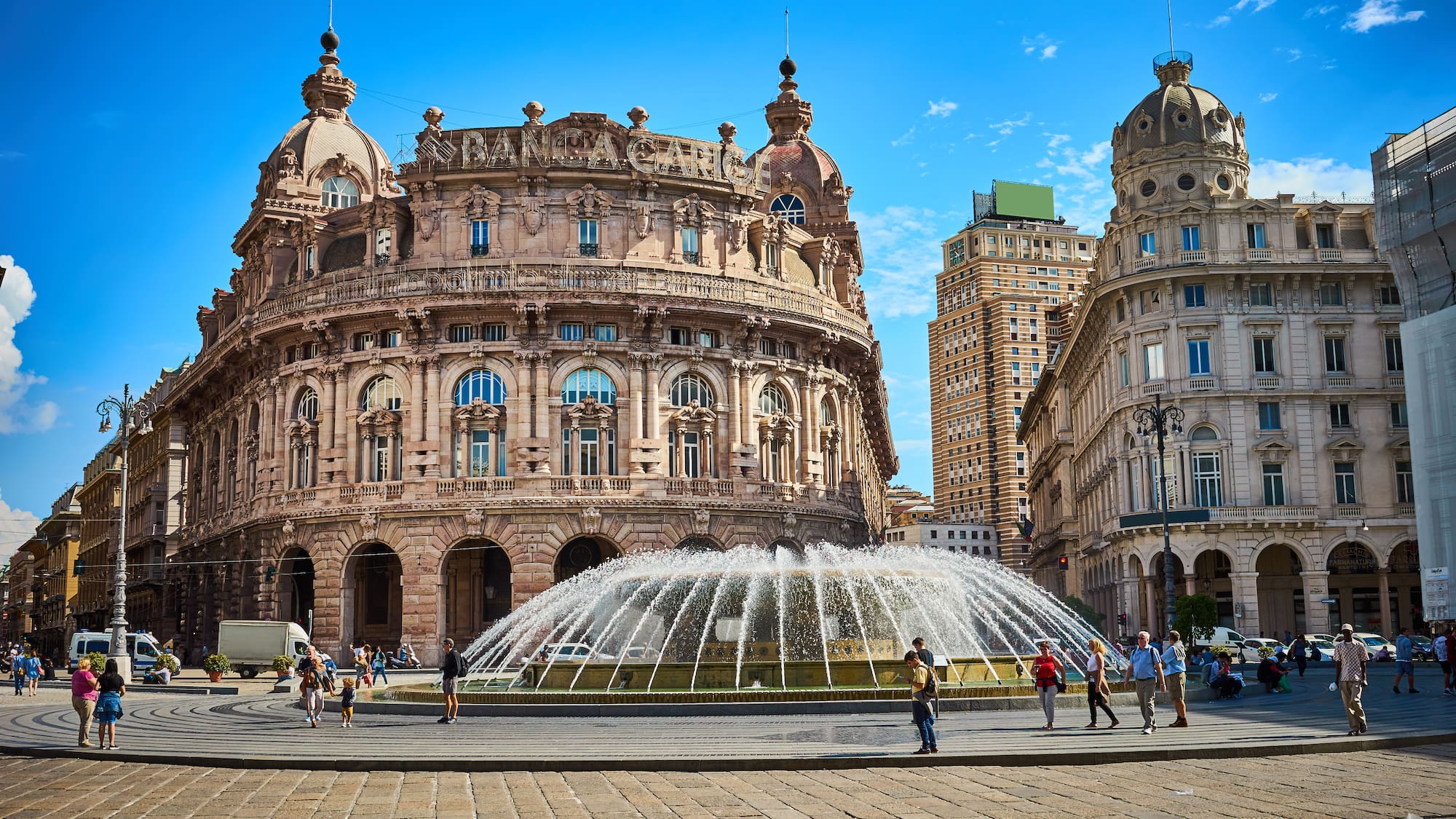 a fountain in front of a large building
