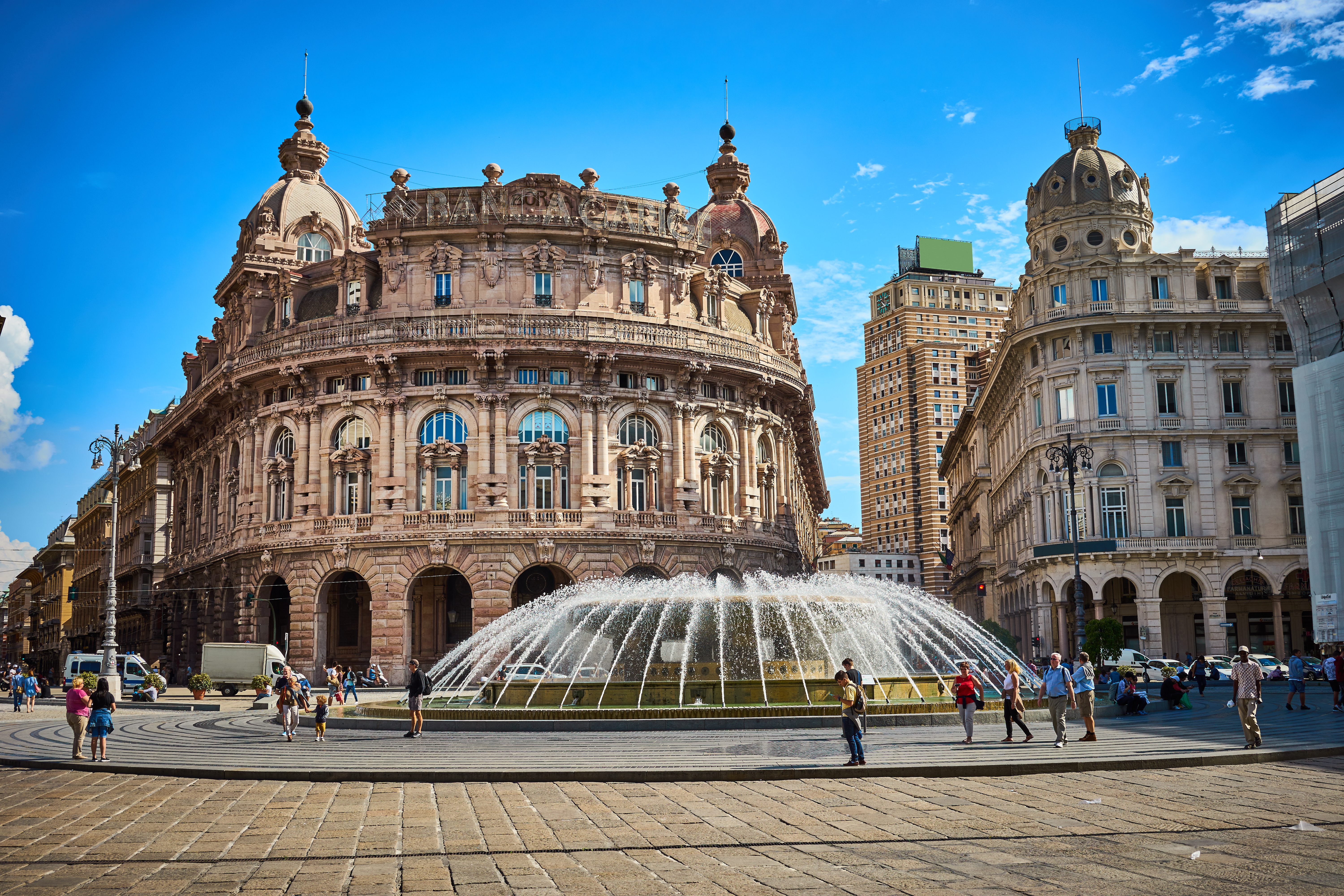 a fountain in front of a large building