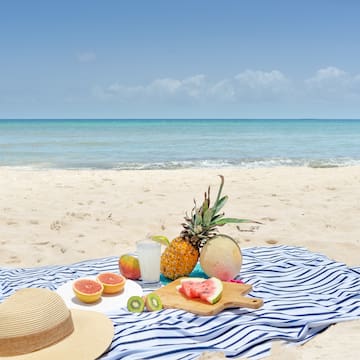 a picnic blanket on the beach